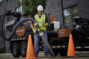 Subsite utility locator being used to detect underground utilities during spring excavation work