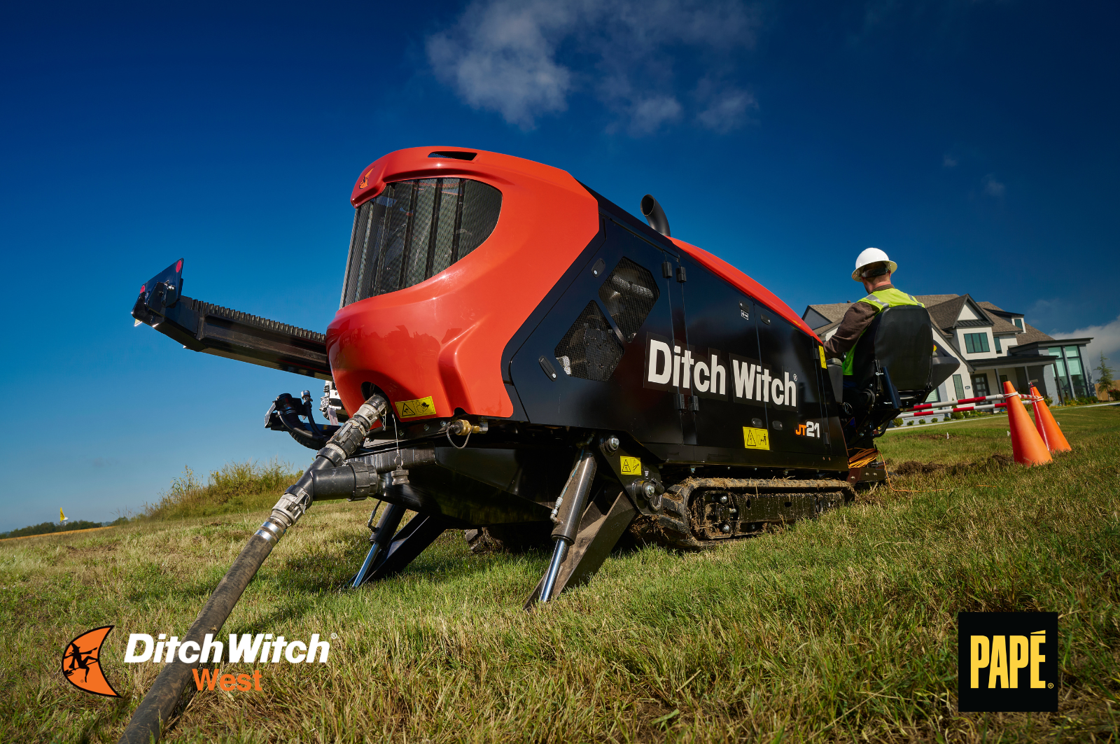 Ditch Witch JT24 directional drill installing underground utilities on a residential construction project