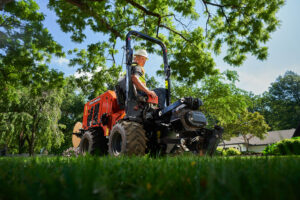 Ride-on trencher operating on a residential utility installation and underground construction project
